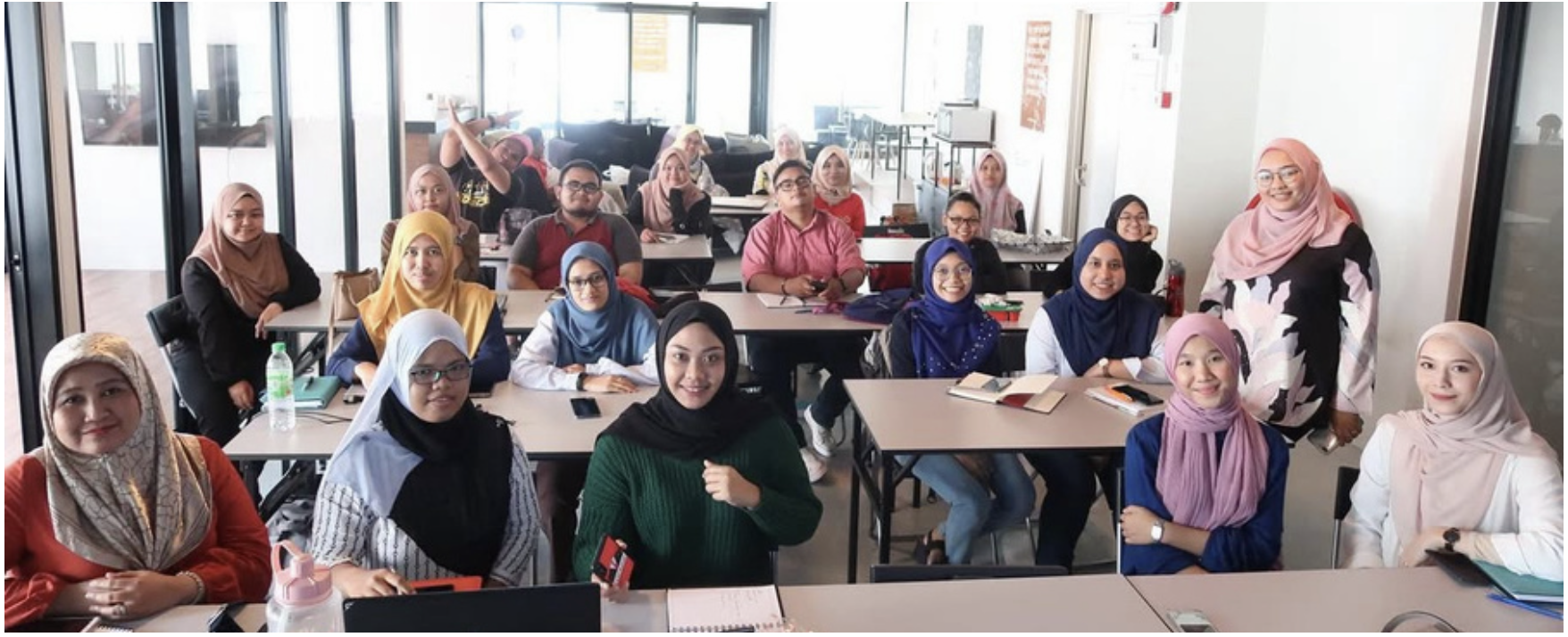 Interactive session showing certified participants smiling
